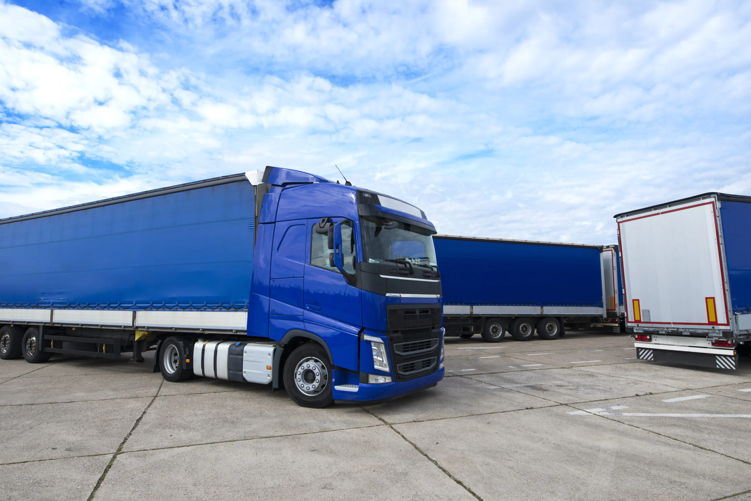 Truck Vehicle With Trailers In Background.